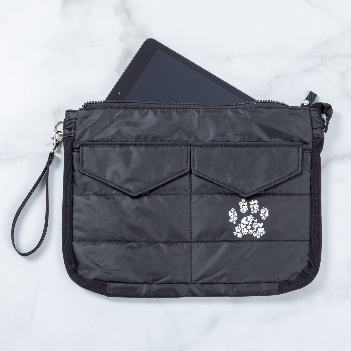 Black quilted tablet carrying case with paw print front applique, zipper closure