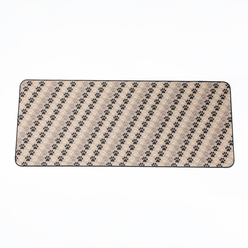 Rectangular floor runner with tan background and black paw print design