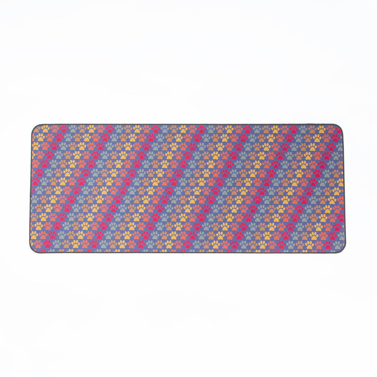 Rectangular floor runner with blue base and scattered multicolor paw print pattern