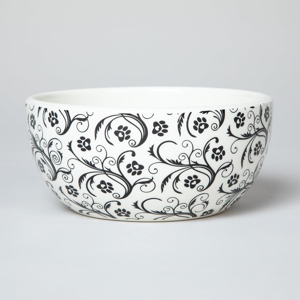Ceramic black-and-white paw and swirl soup bowl with curved shape and wide rim