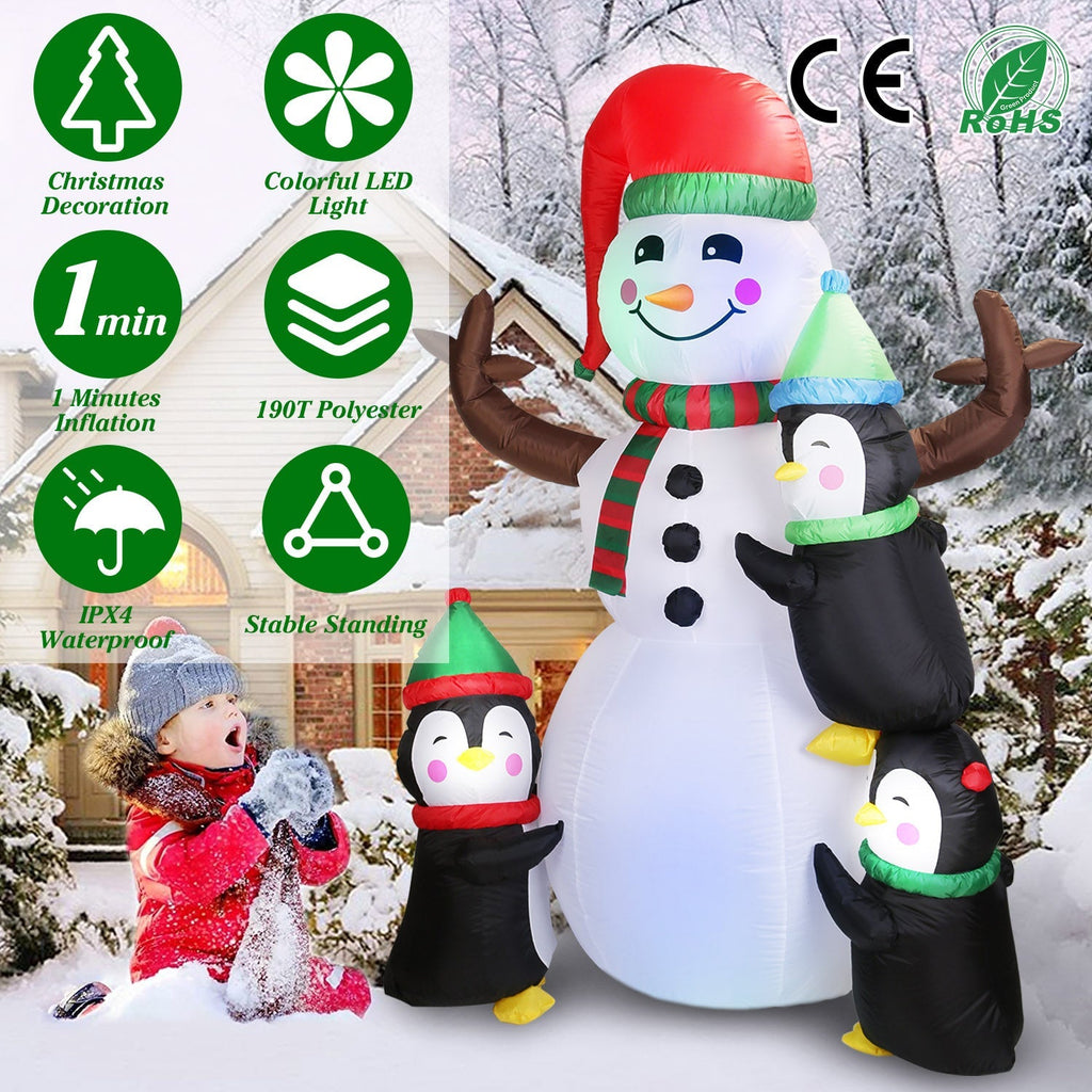 Inflatable snowman with penguins and red cap, striped scarf, white LED glow