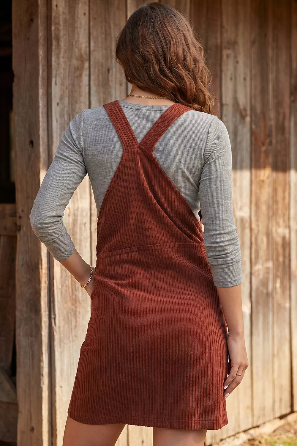Burgundy ribbed corduroy zip-up sleeveless pocket sheath dress, layered gray top, back