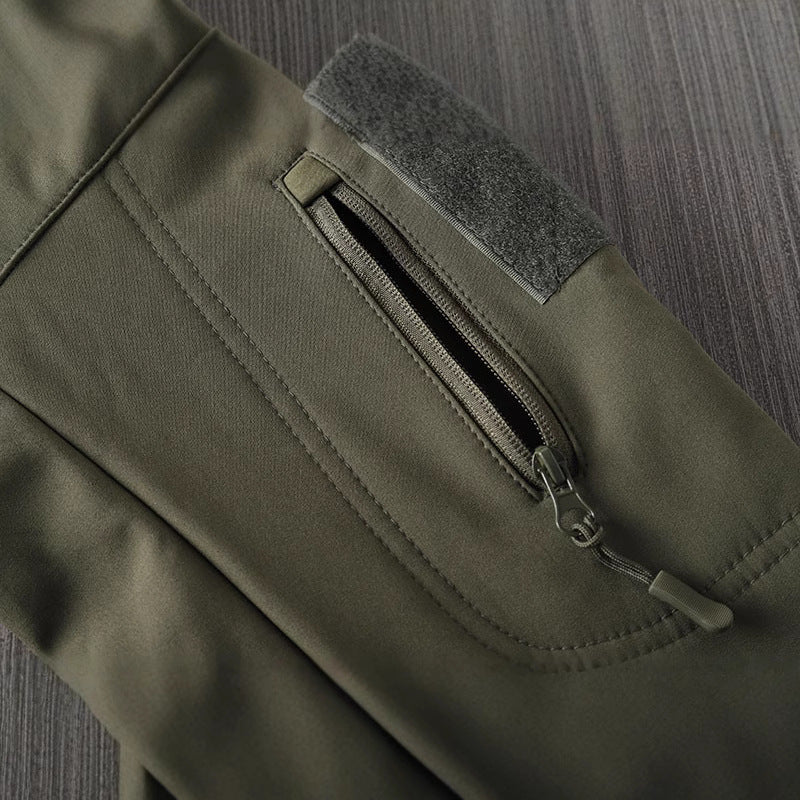 Men's waterproof shell jacket side zip pocket with gray fabric patch