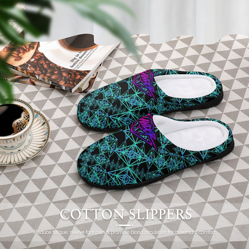 Teal cotton slip-on slippers with purple accents and white interior, set on floor.