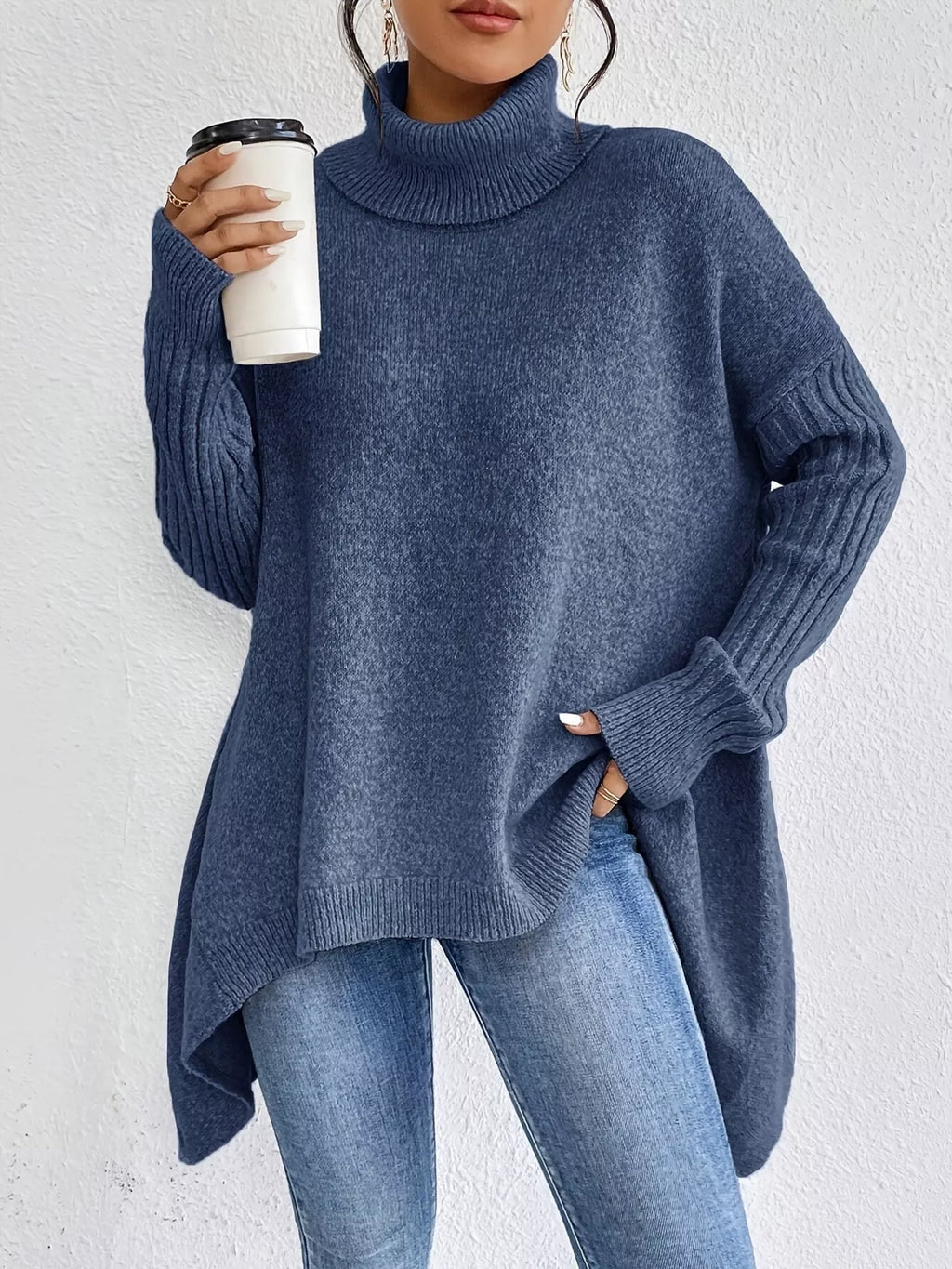 Navy oversized turtleneck sweater with ribbed cuffs and asymmetrical hem detail
