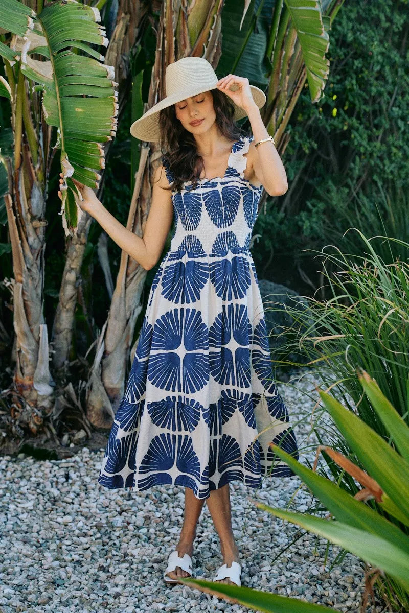 Sleeveless navy abstract print midi dress with smocked bodice and tiered skirt detail