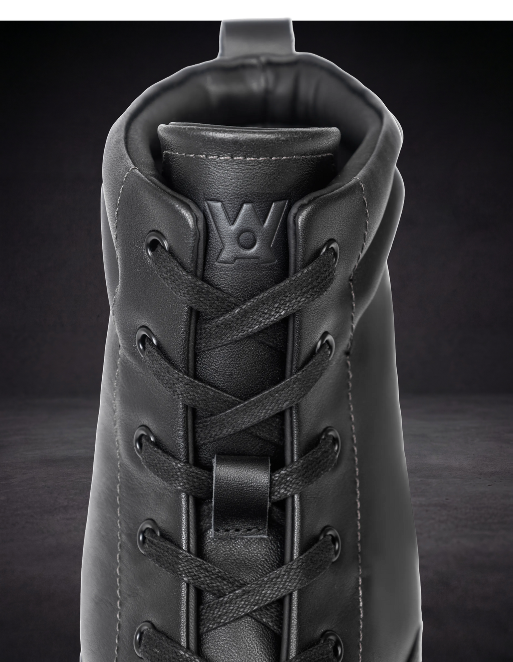WOA lace-up boot front with woven laces and padded tongue opening