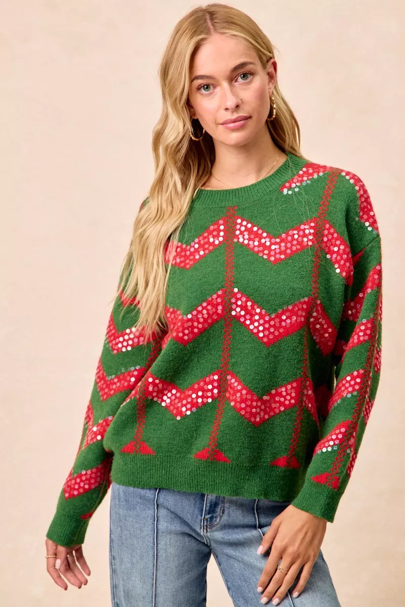 Green chevron knit sweater with red zigzag sequin detail, crew neck