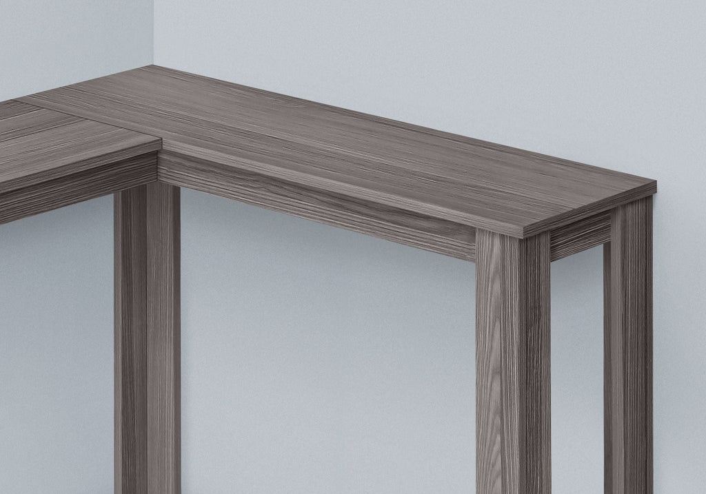 Corner accent console table corner top detail in gray wood tone with sturdy legs.