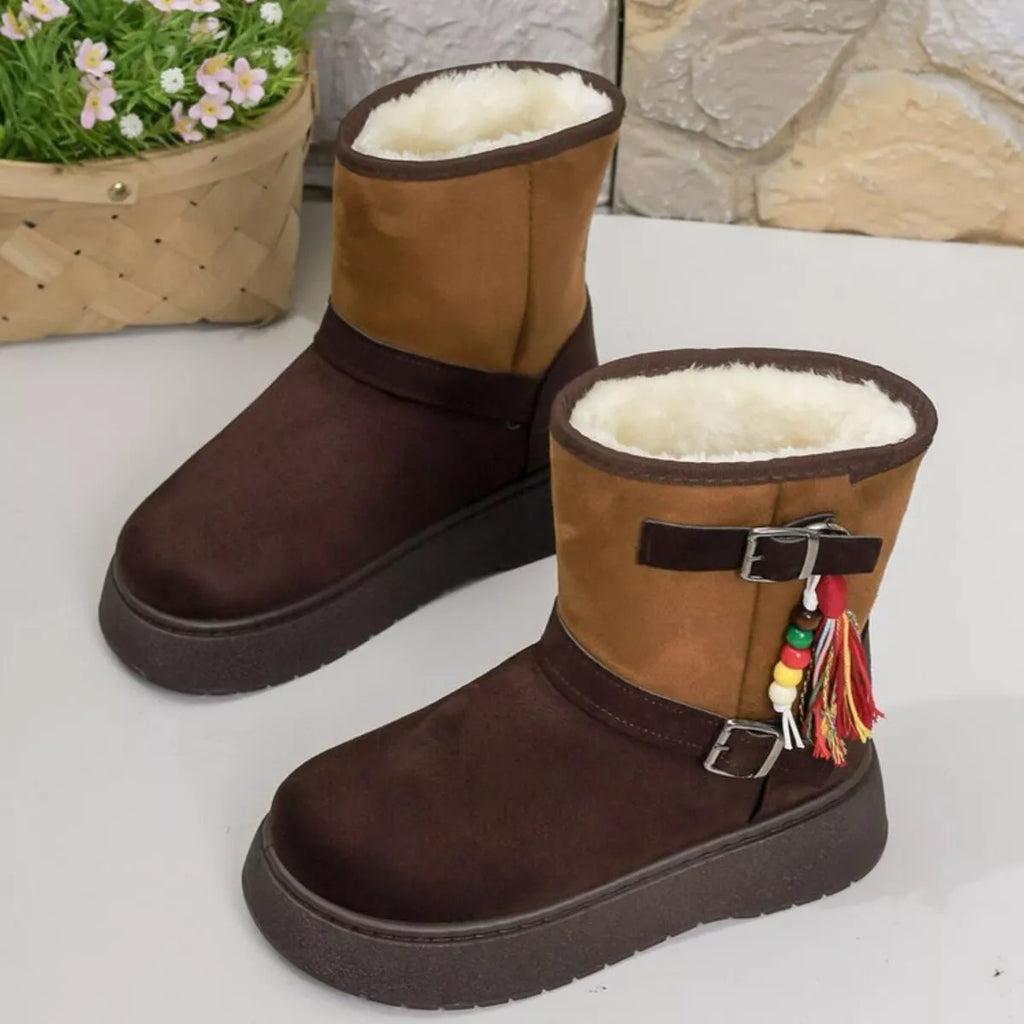 Faux-fur lined ankle boots with buckles and tassels in brown and tan.