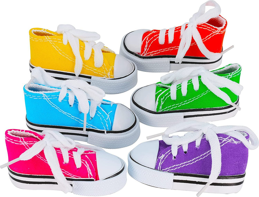 Six mini bird sneakers in yellow, red, blue, green, pink, and purple
