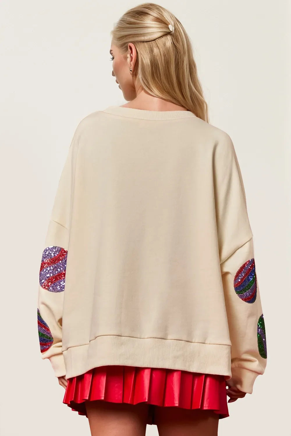 Cream long-sleeve sweatshirt back view with sequin candy-cane heart patches