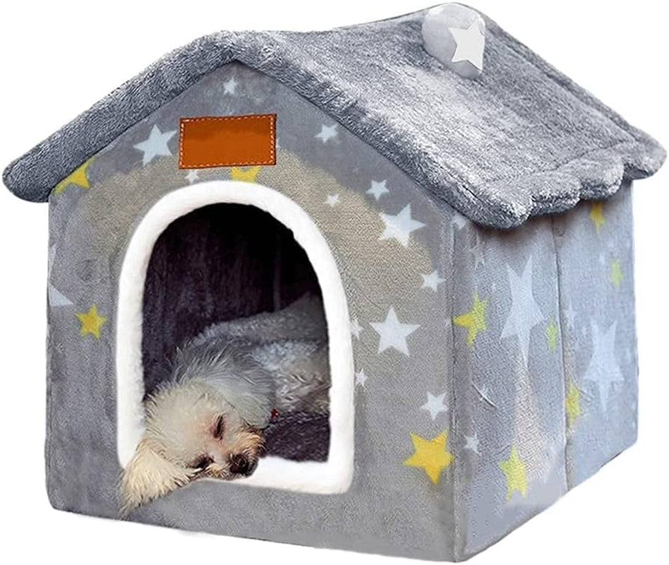 Gray indoor dog house bed with star pattern, plush roof flap, and white arched entrance.