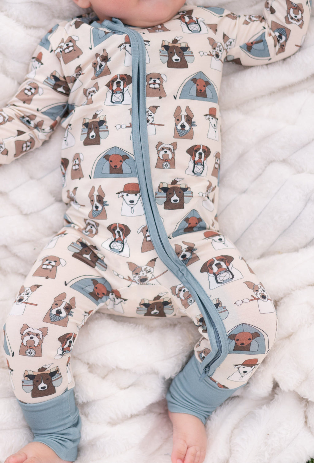 Dog-print convertible zip footie with blue-gray zipper and folded foot openings