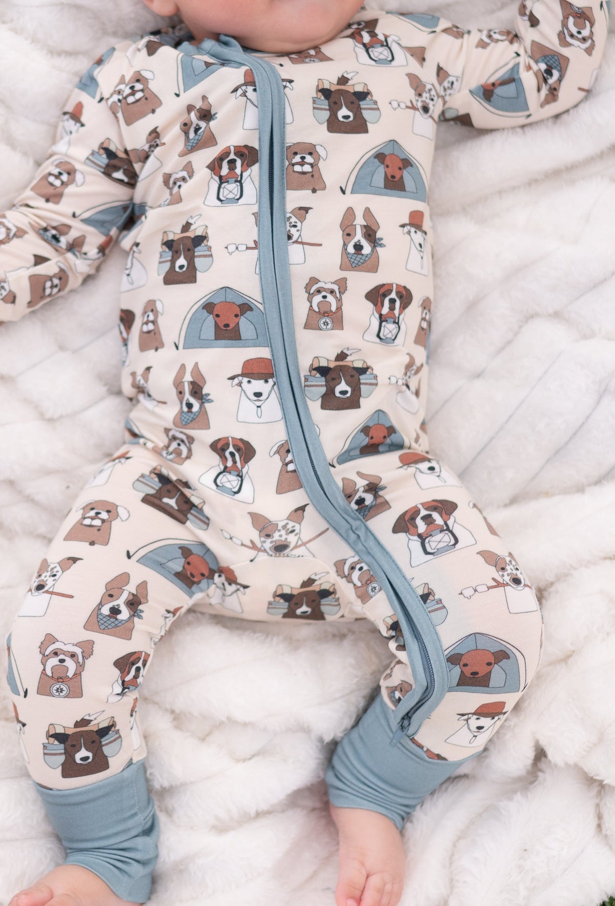Dog-print convertible zip footie with blue-gray zipper and folded foot openings