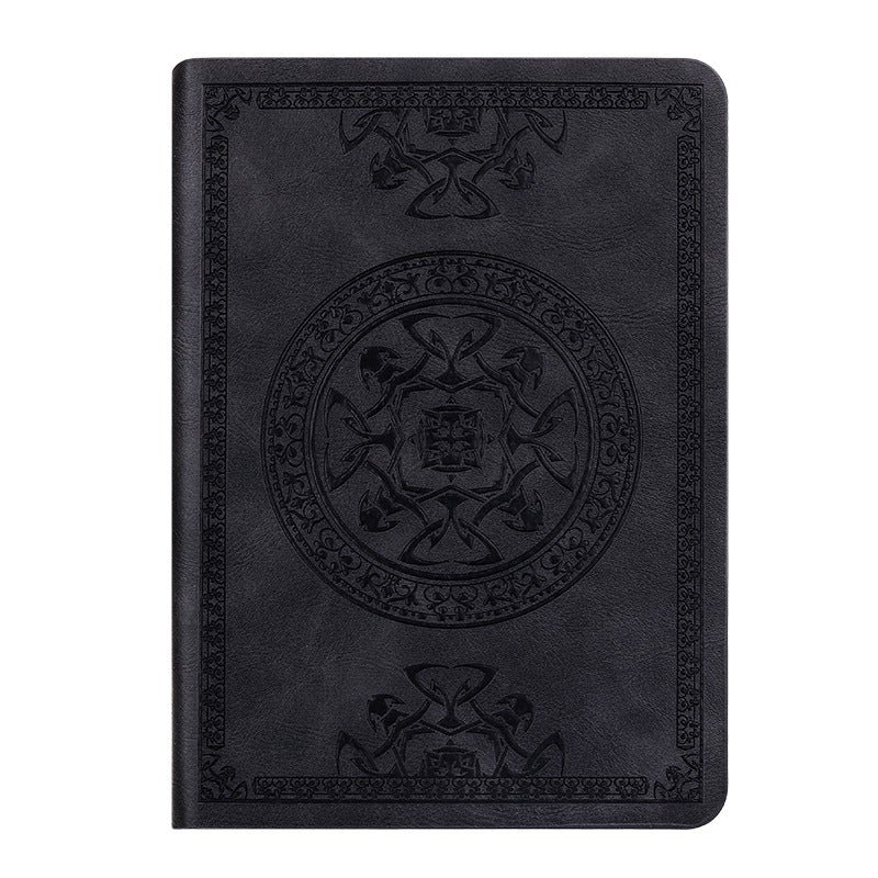A6 leather mini notebook with embossed dark emblem on black cover