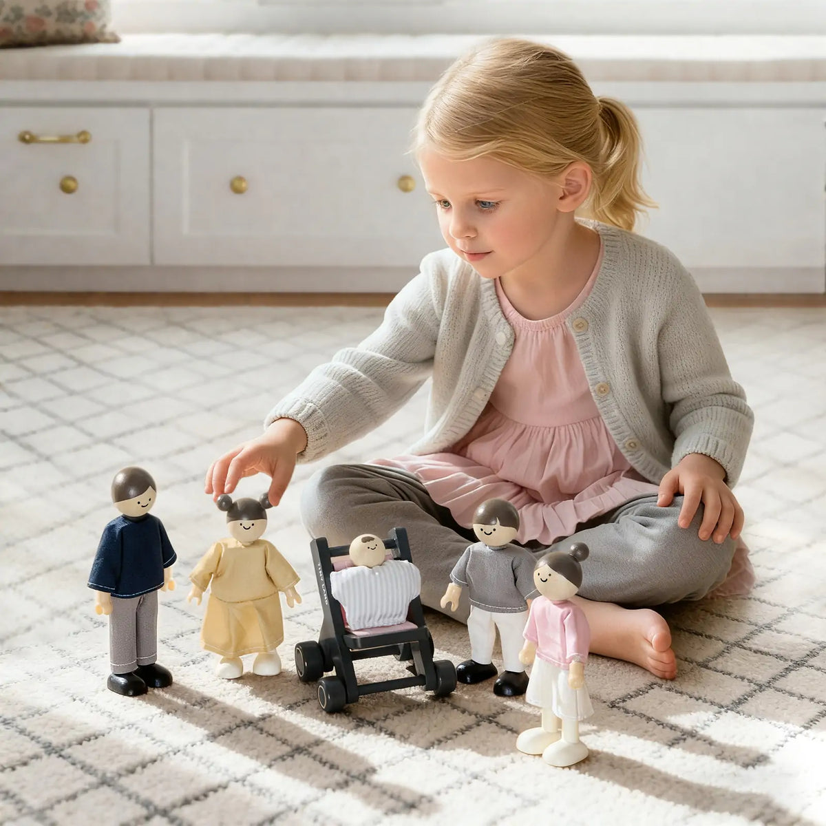 Mini dollhouse playset with small dolls and accessory pieces