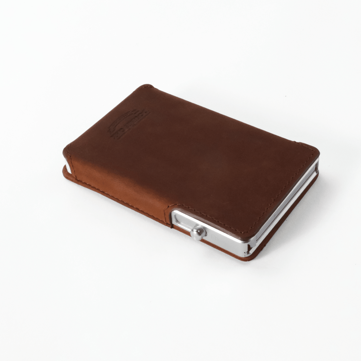 Brown leather bifold wallet closed with silver-tone snap clasp