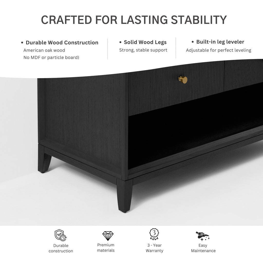 Black bath vanity base with tapered legs and gold knobs, textured wood cabinet front