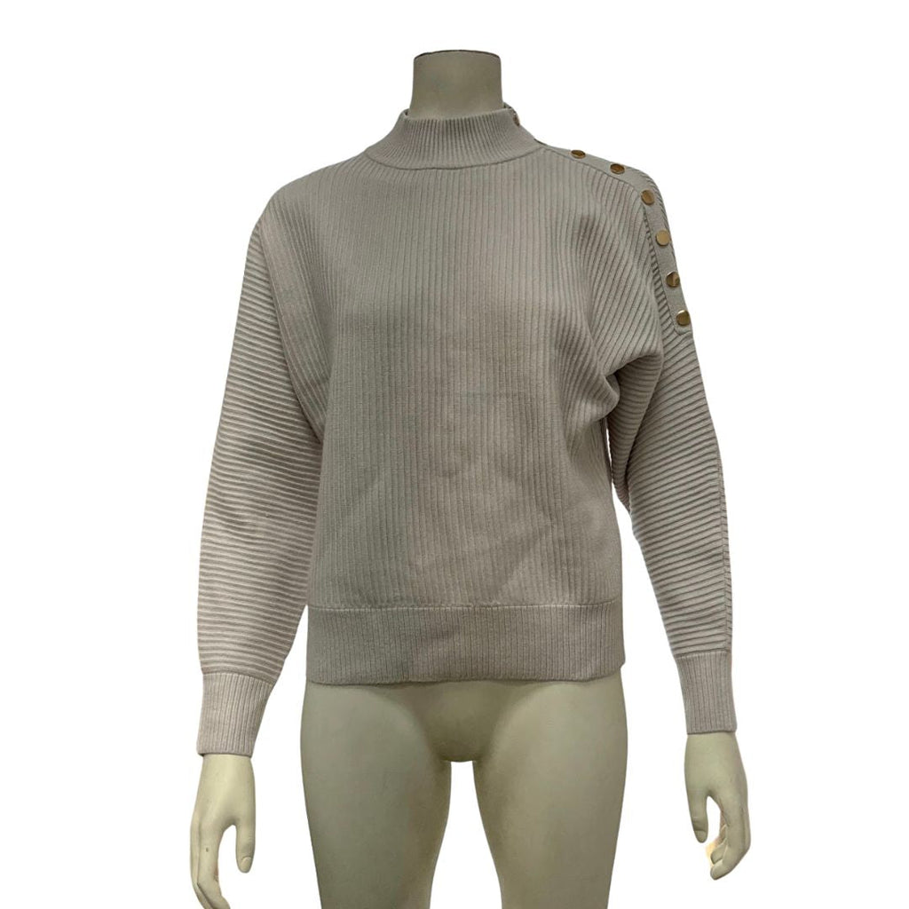 Beige ribbed mock neck sweater on mannequin with gold button shoulder trim