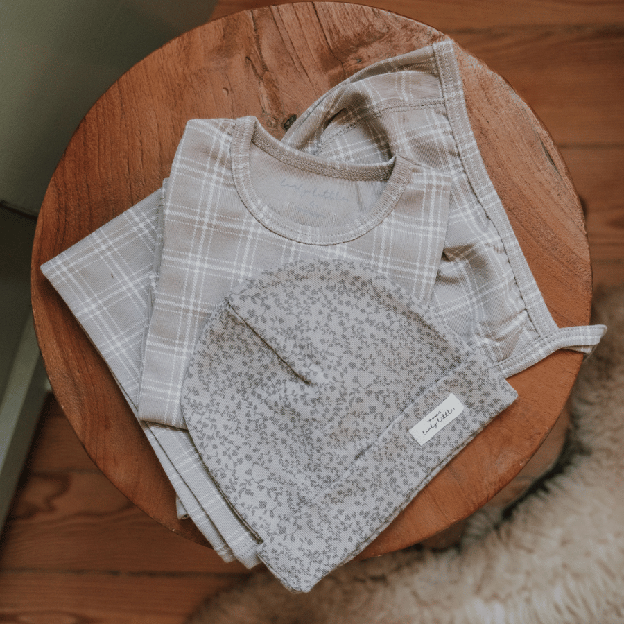 Baby jacket with hood, speckled bib front and light plaid sleeves