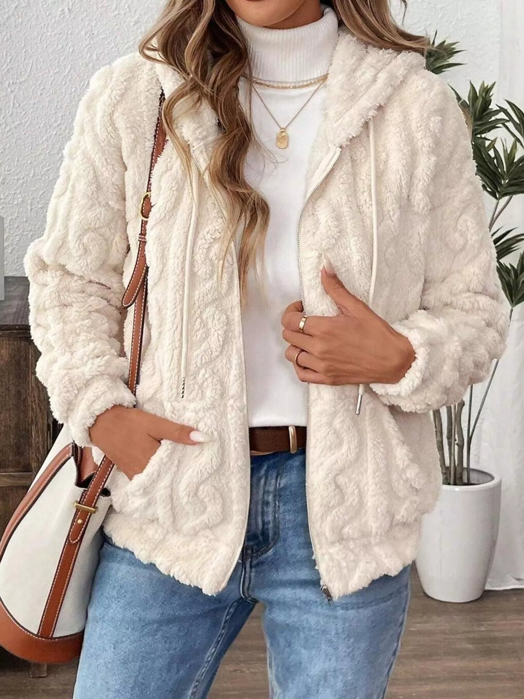 Ivory fleece zip-up hoodie with hood and drawstring, front close-up