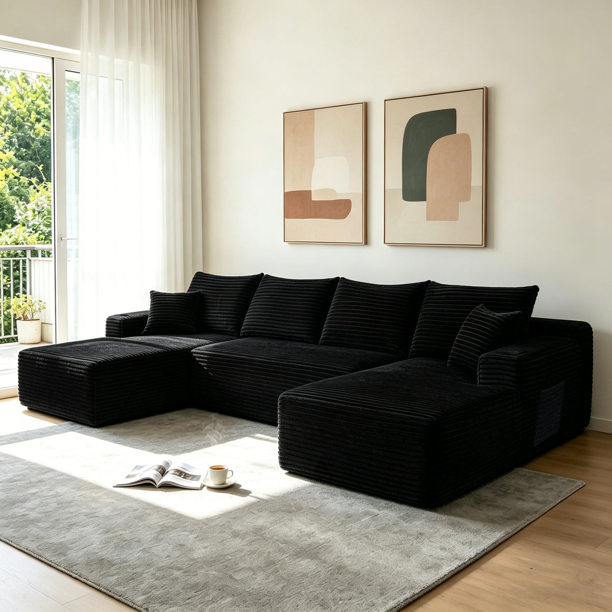 Black U-shaped sectional sofa with chaise, deep cushions and multiple throw pillows