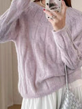 Pink cable-knit round neck sweater with long sleeves and ribbed hem