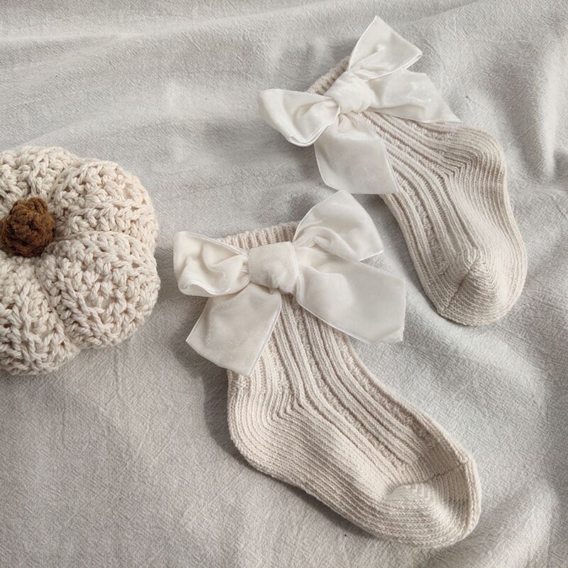 White wool tube socks with large bowknot cuffs