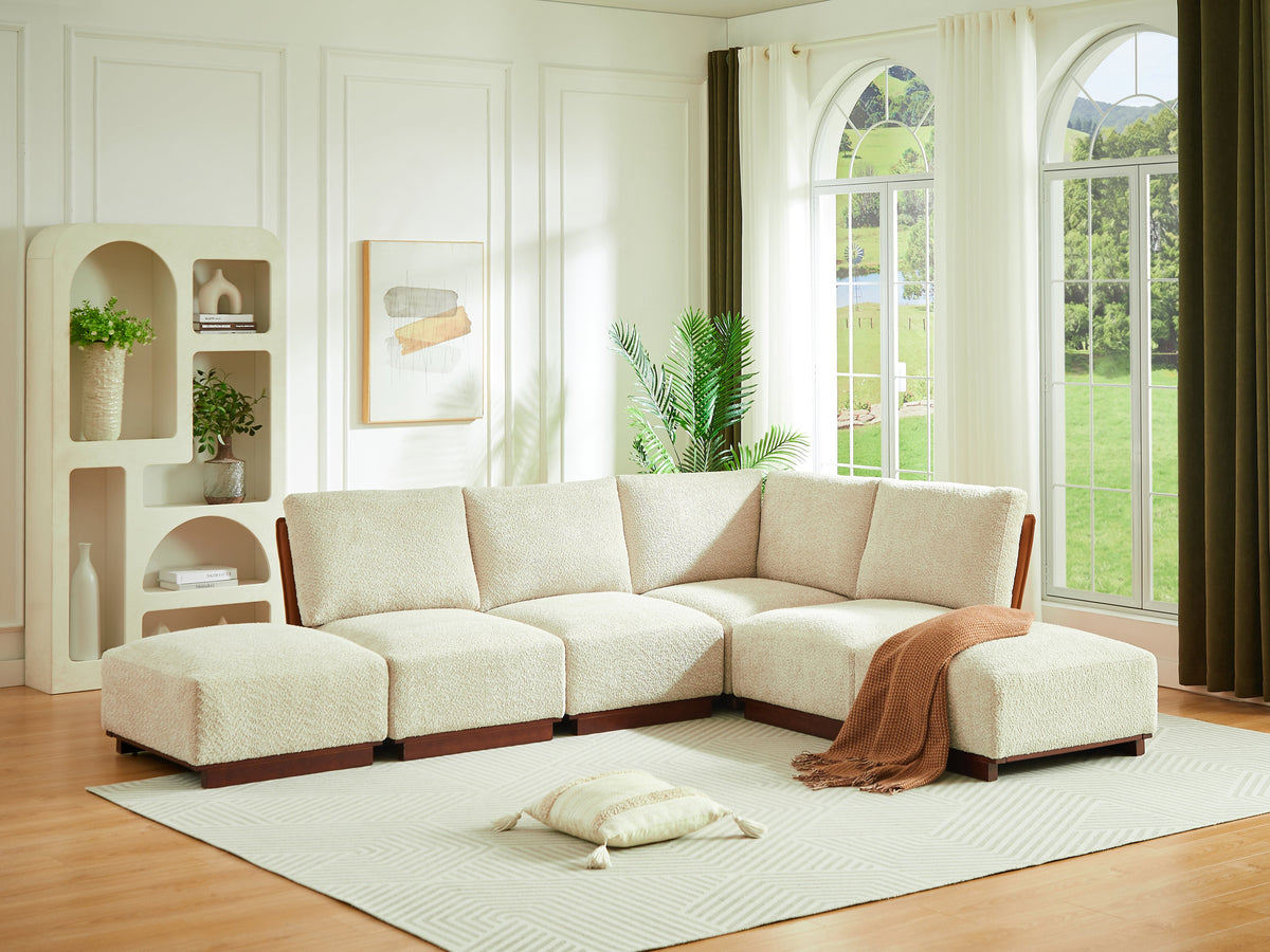 L-shaped modular sectional sofa with light sesame boucle cushions and chaise ottoman