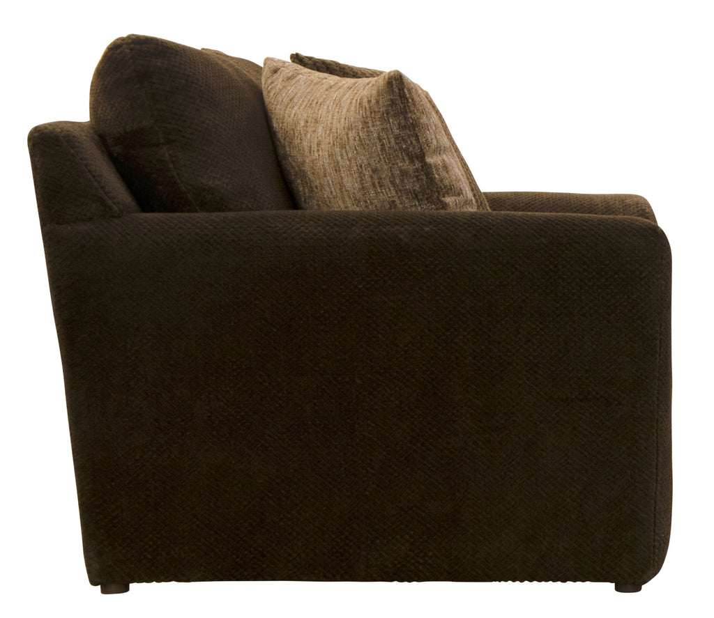Midwood chair with dark upholstery and back pillows in dark and tan tones