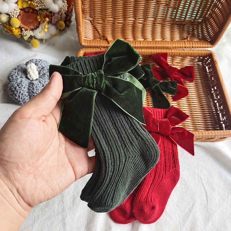 Dark green and red wool tube socks with bowknot cuffs
