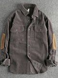Plus-size corduroy button-up shirt in dark gray with two chest pockets and tan contrast sleeve panels