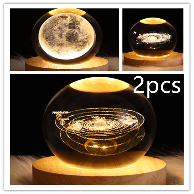 Galaxy crystal ball LED night light with swirling orbit pattern on wooden base