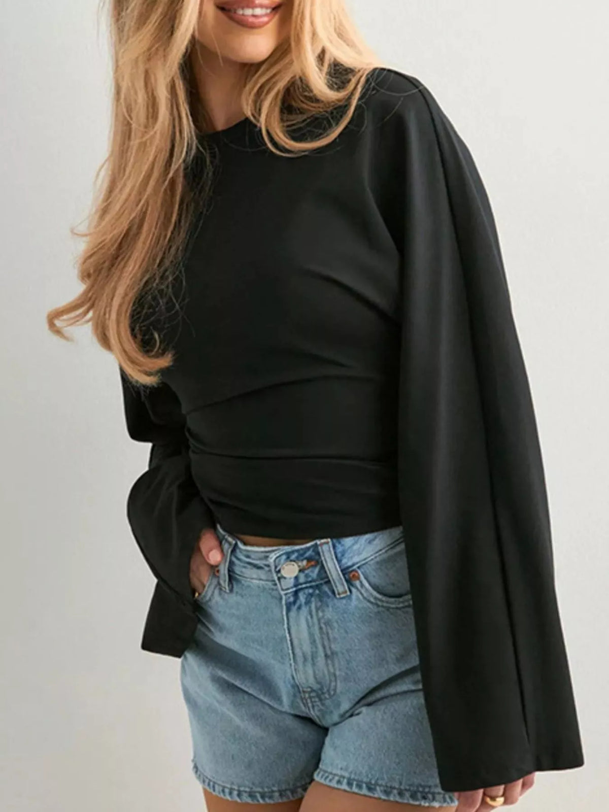 Black long-sleeve fitted t-shirt with crew neck and flared bell sleeves