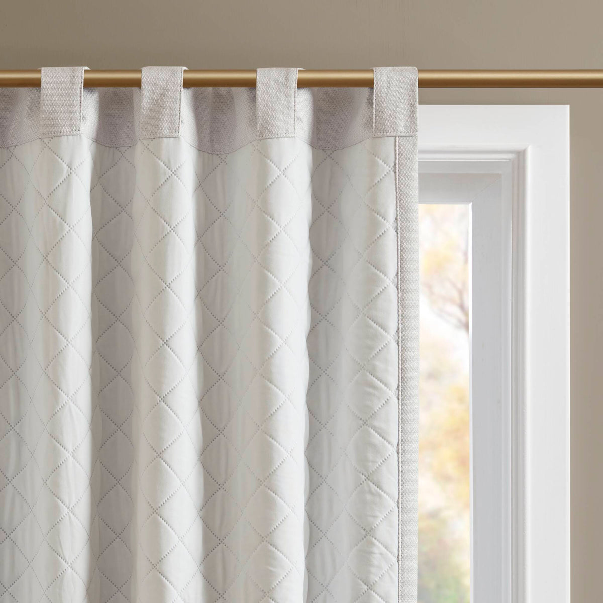 White blackout curtain pair, top header with hanging loops on a rod
