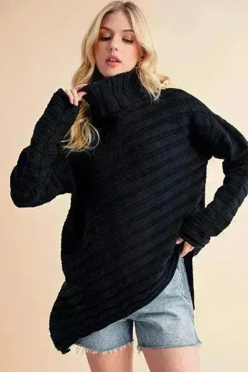 Black asymmetrical turtleneck sweater with long sleeves and draped side-slit hem