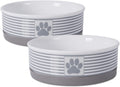 Two gray and white striped ceramic pet bowls with paw-print badges and removable bases