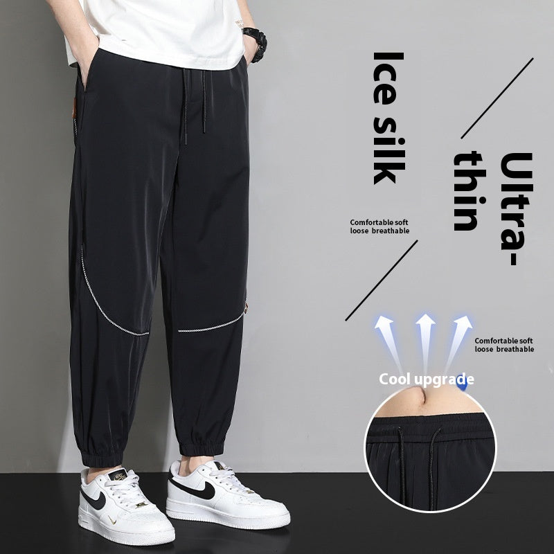 Men's tapered casual pants in black, drawstring waist, cuffed ankle hems