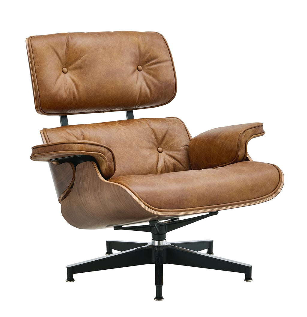 Brown leather lounge chair with padded headrest, wide armrests, and black cross base