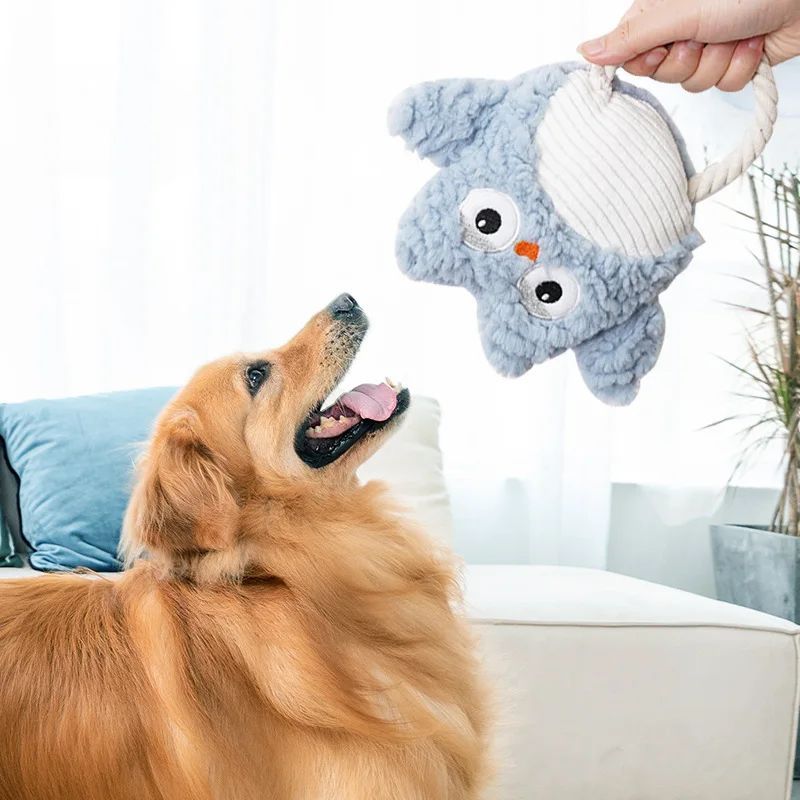 Blue plush shark dog toy with striped belly, squeaker-style, bite-resistant