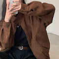 Brown velvet coat jacket with curved collar, snap buttons, and dual zip front