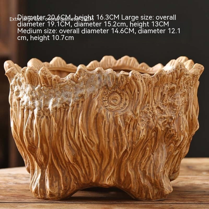Large ceramic planter with tree-root carved texture, lighter glaze and rounded base