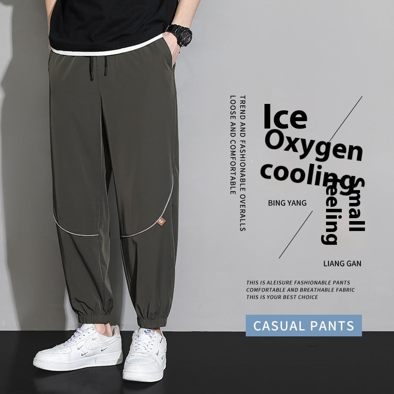 Men's tapered casual pants in army green, drawstring waist, cuffed ankle hems