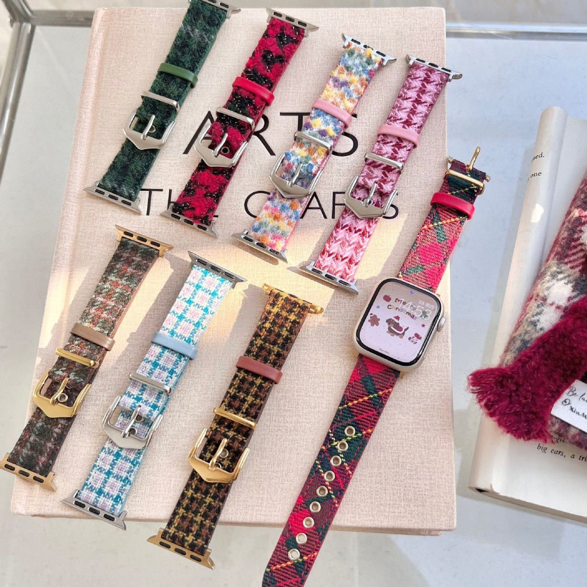 Christmas wool and leather watch strap display, various festive patterned bands with metal buckles