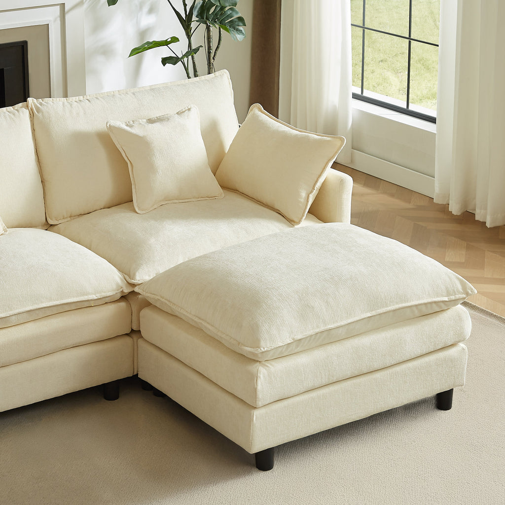 Cream chenille sectional with ottoman extension and three throw pillows