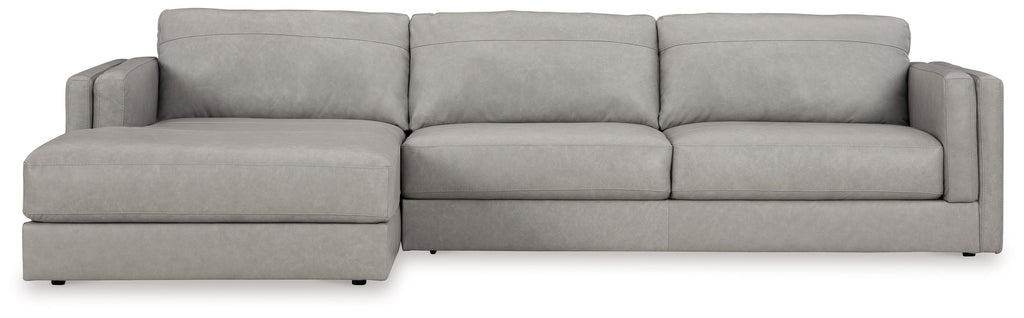Light gray upholstered sectional sofa with corner chaise, wide seating and padded arms