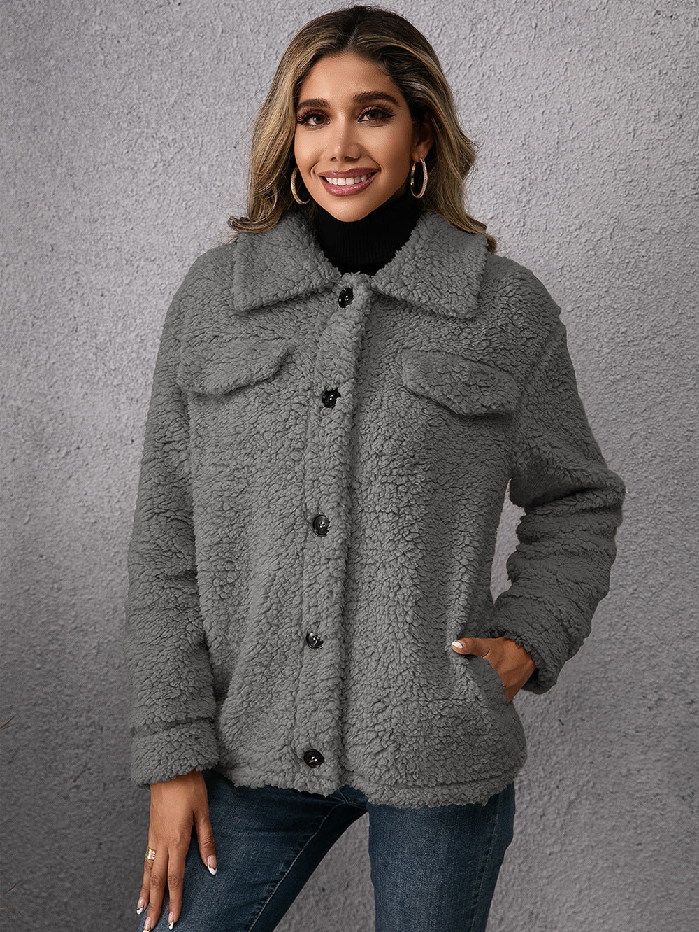 Grey fleece button-up coat with lapels, front pockets, and dark buttons
