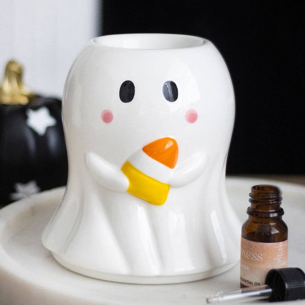 White ghost oil burner wax warmer with candy-corn style nose, smiling face
