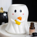 White ghost oil burner wax warmer with candy-corn style nose, smiling face